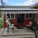 Aleko Products || Retractable Black Frame Patio Awning 12 x 10 Feet - Gray and White Stripes